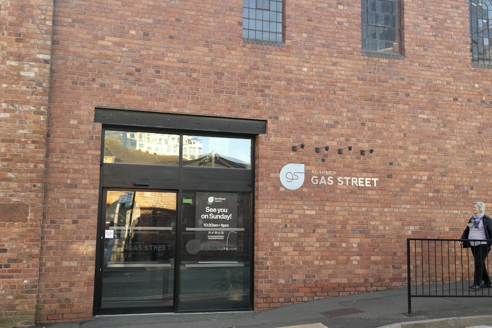 a brick building with a black door