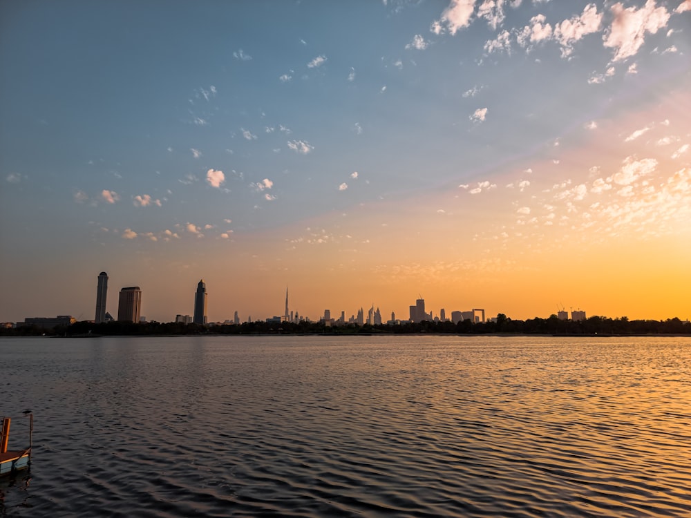 a body of water with a city in the background