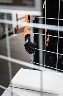 a person holding onto a railing