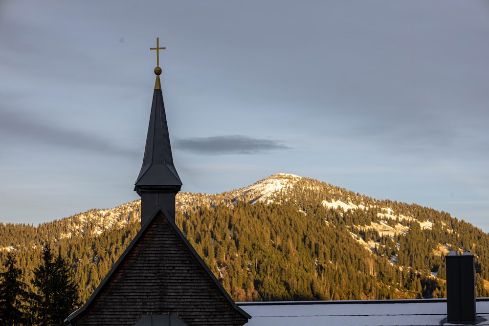 a church with a mountain in the background