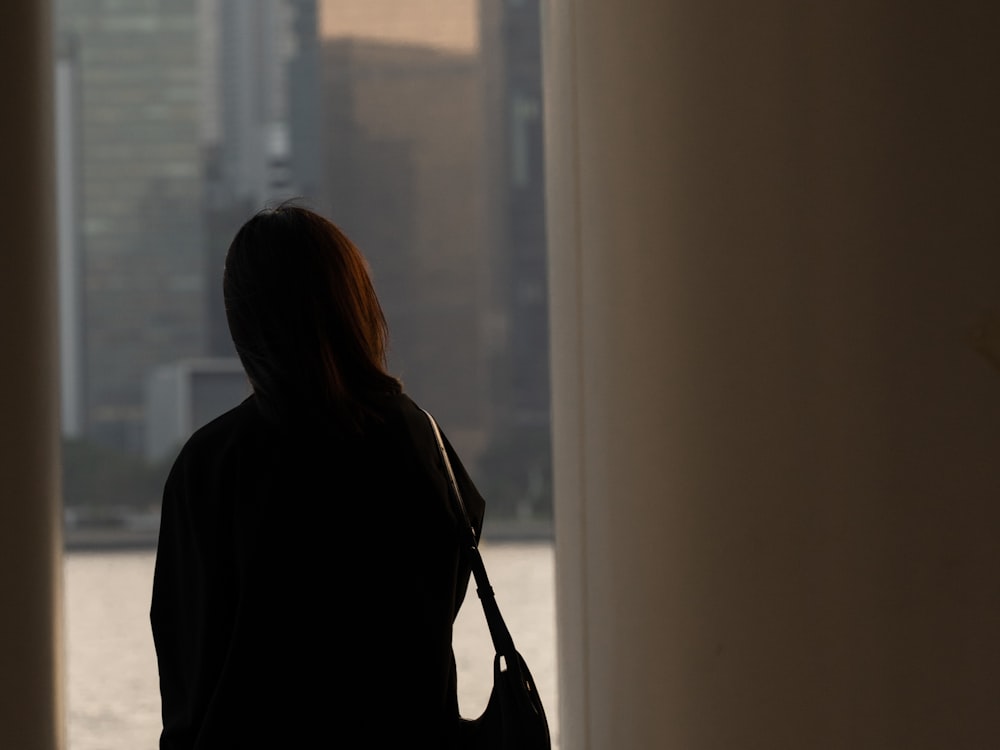 a woman looking out a window