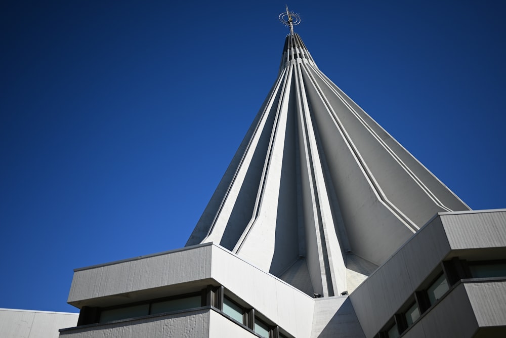 a white building with a cross on top