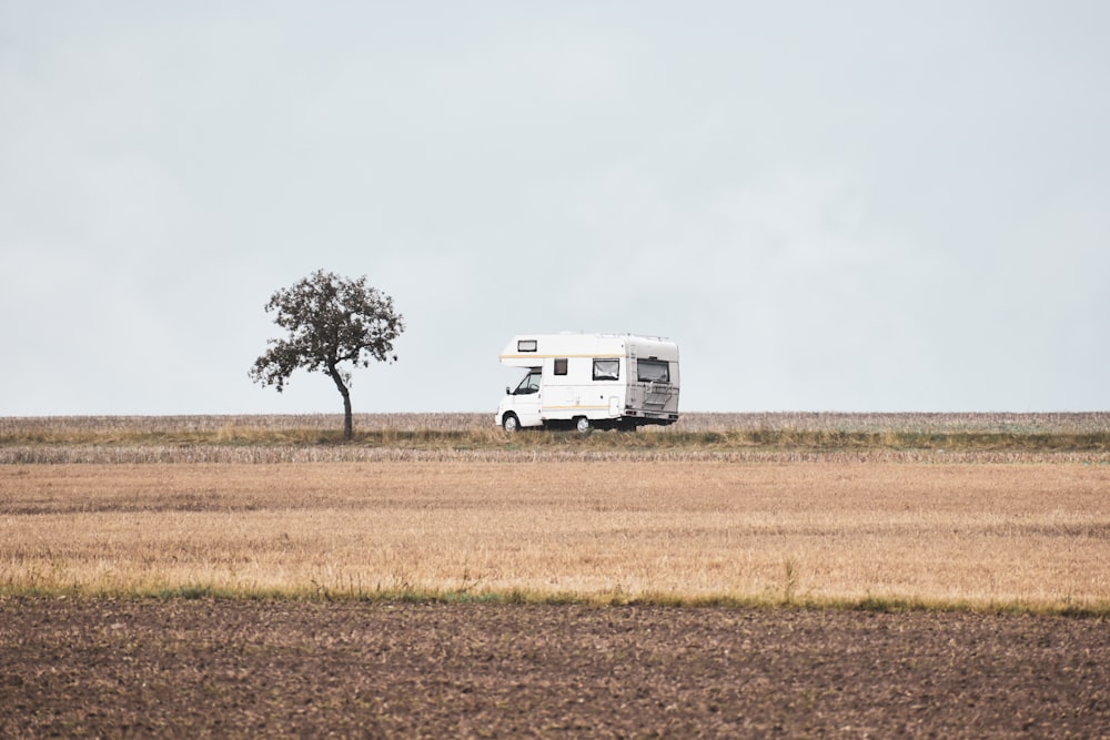 a white truck parked in a field