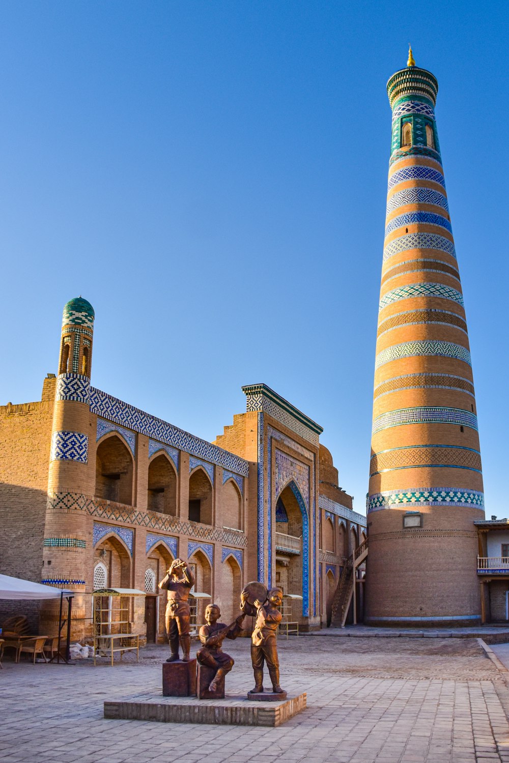 a group of statues in front of a building