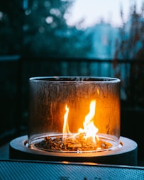 a glass with a flame in it