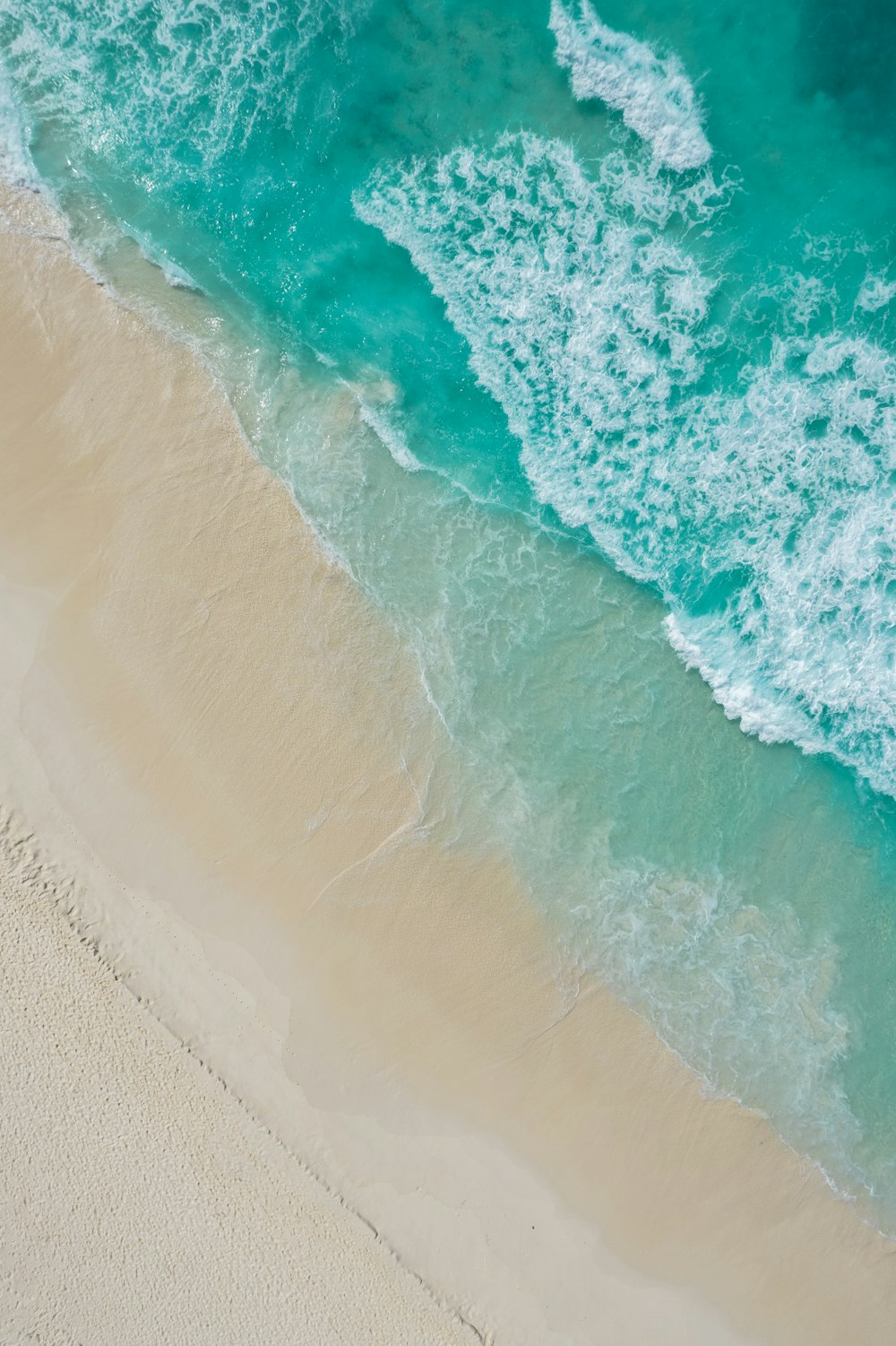 a wave crashing on a beach