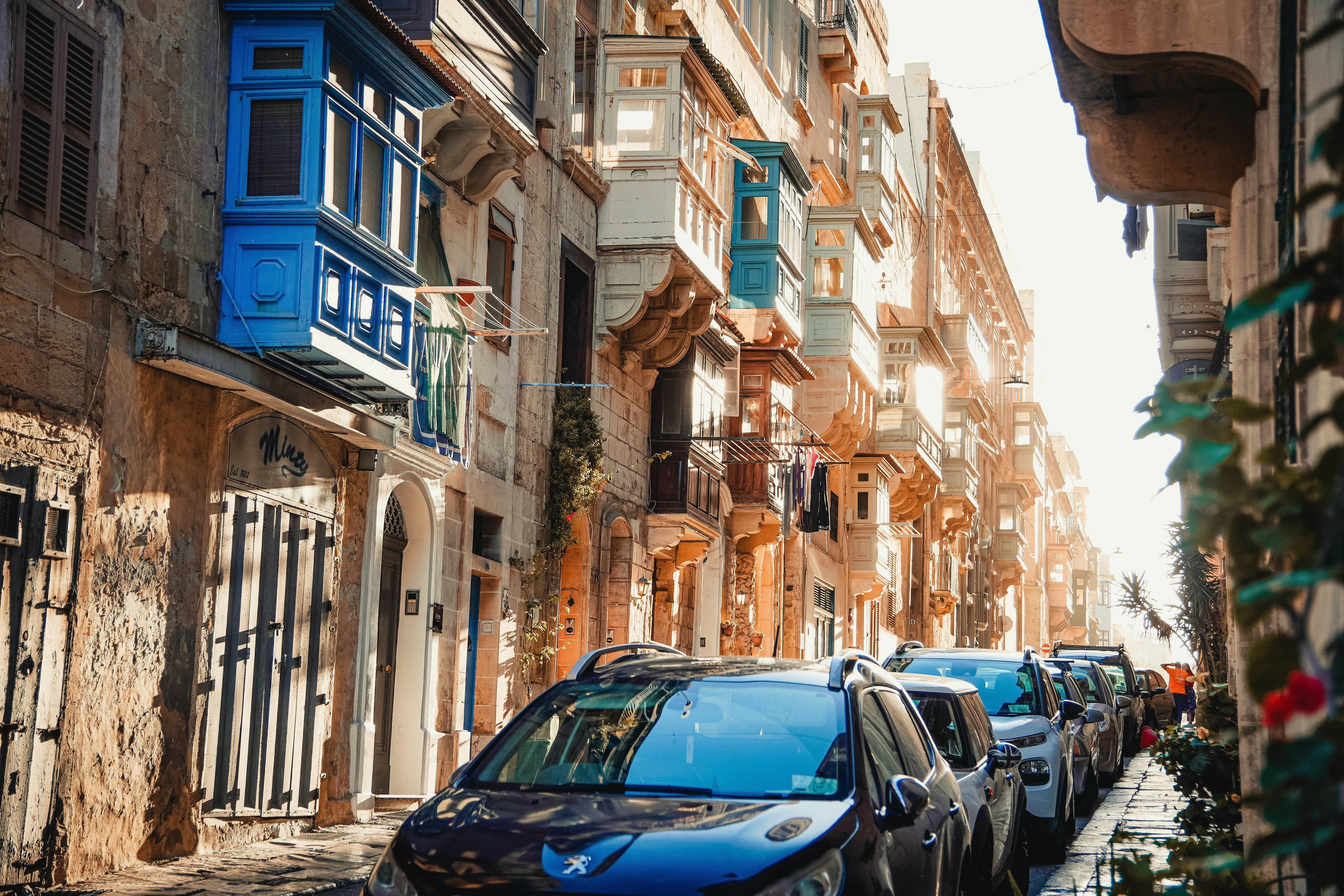 cars parked on the side of a street