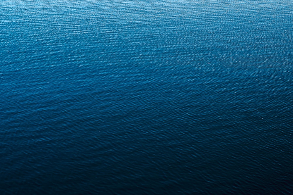 a blue surface with a dark background