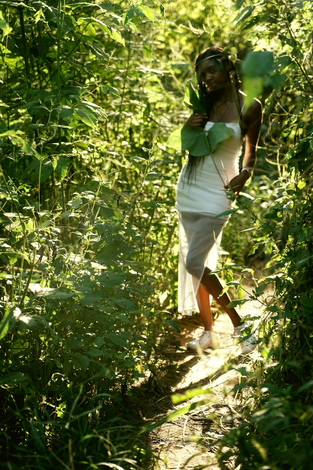 a man walking through a forest