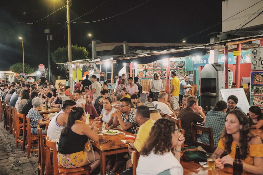 a group of people sitting at tables