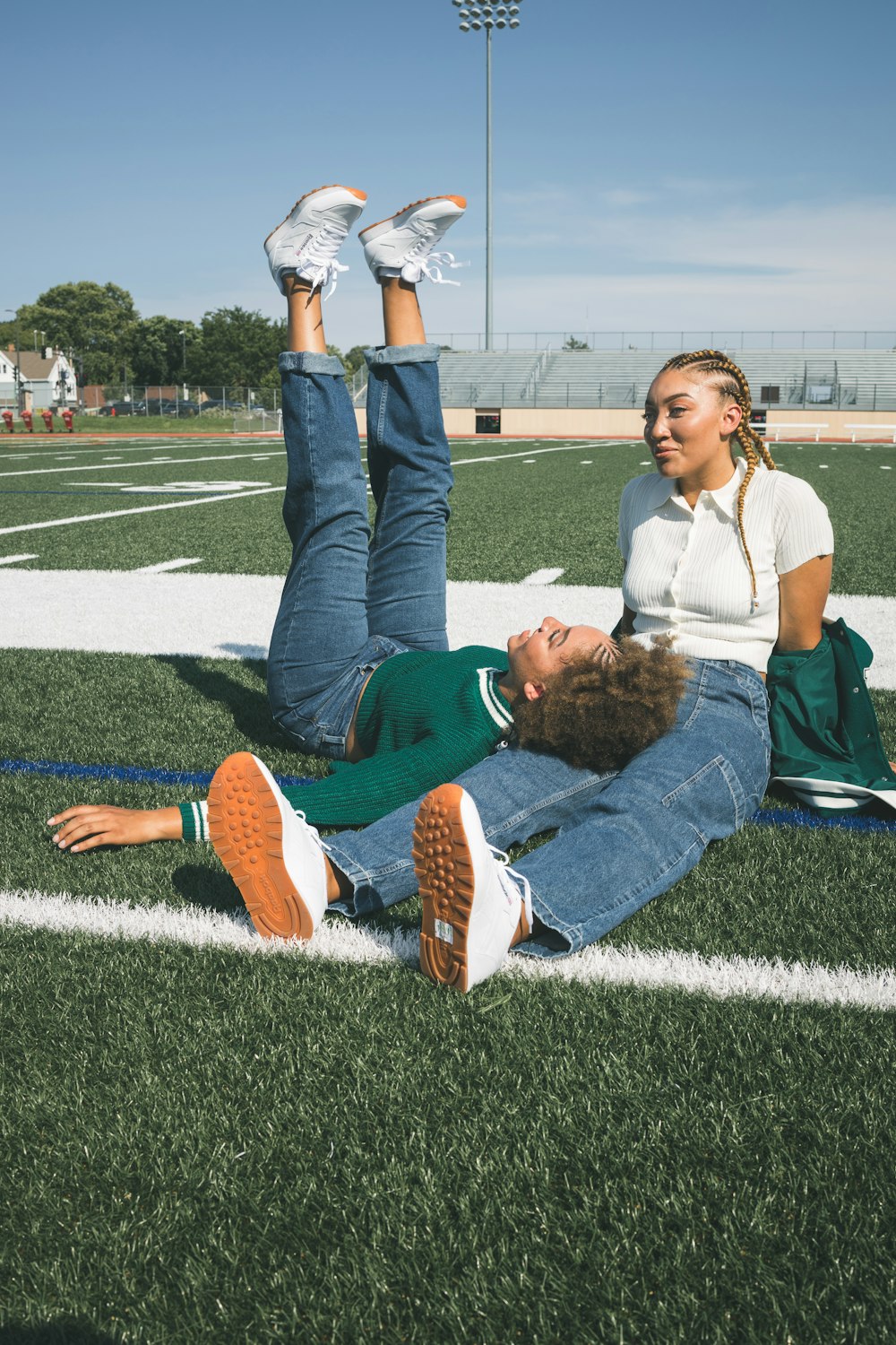 a person doing a handstand on a grass field