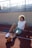 a woman stretching on a track