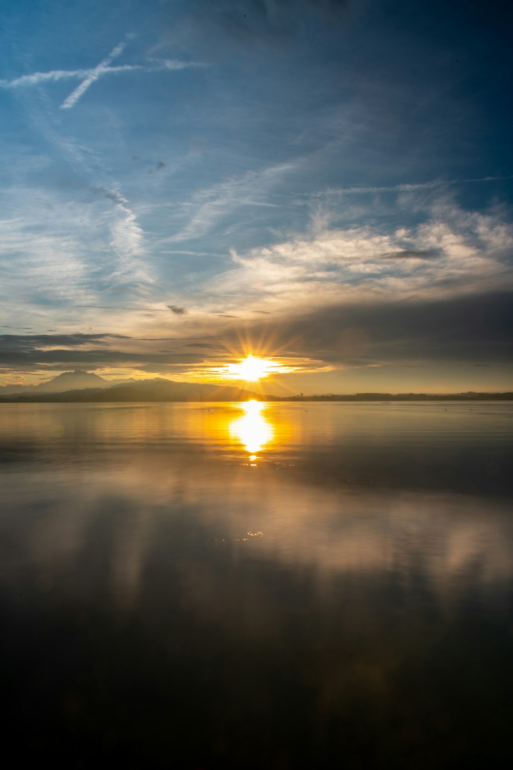 a sunset over a body of water