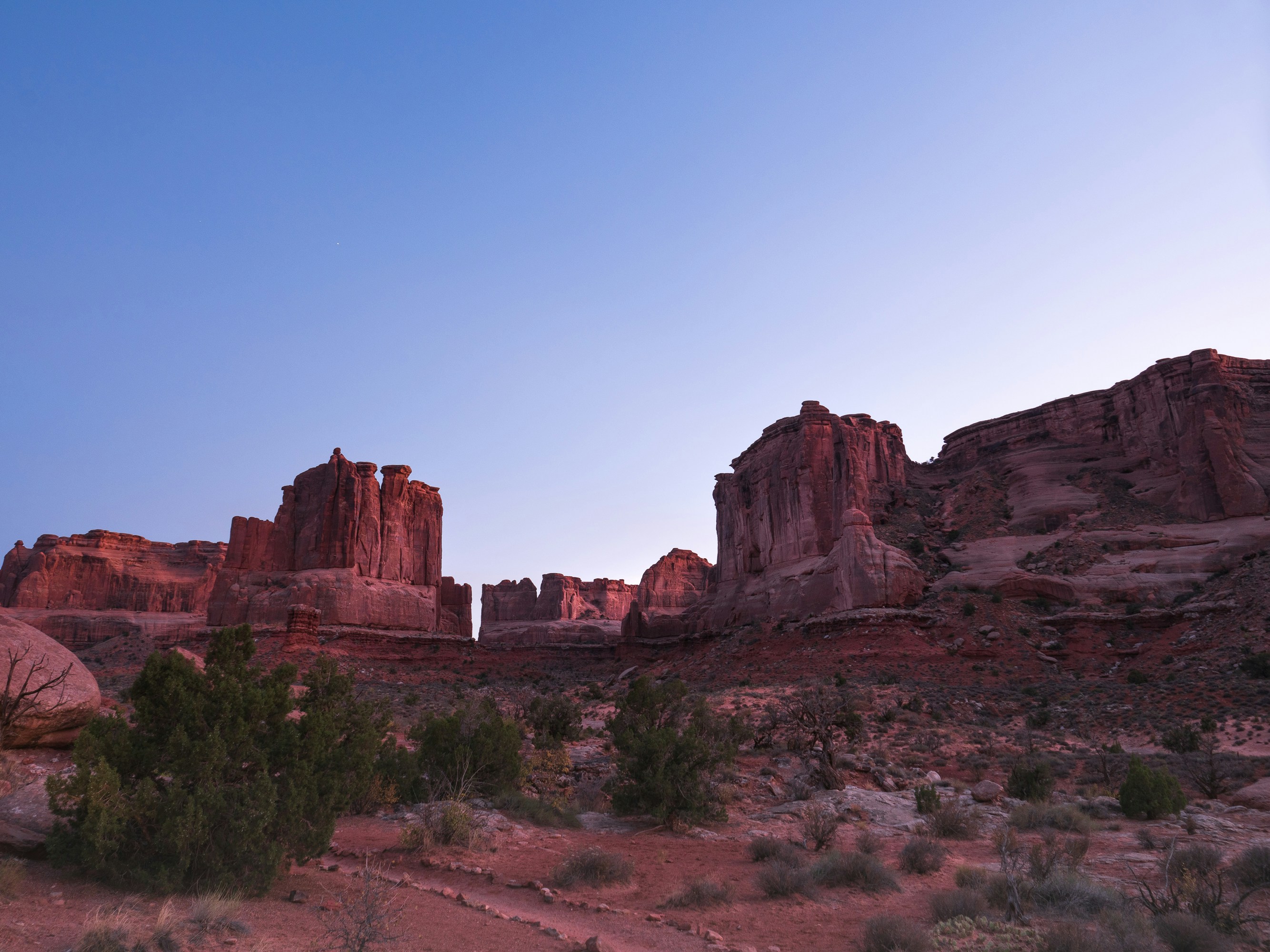 a desert landscape with red rock formations