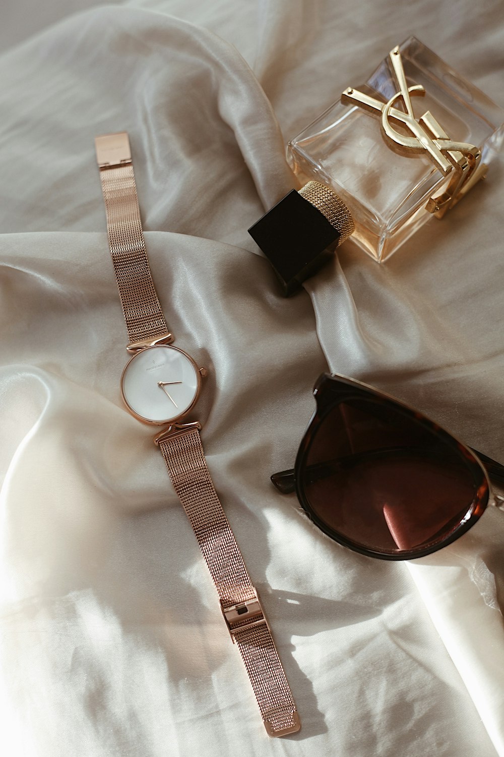 a set of sunglasses and a watch
