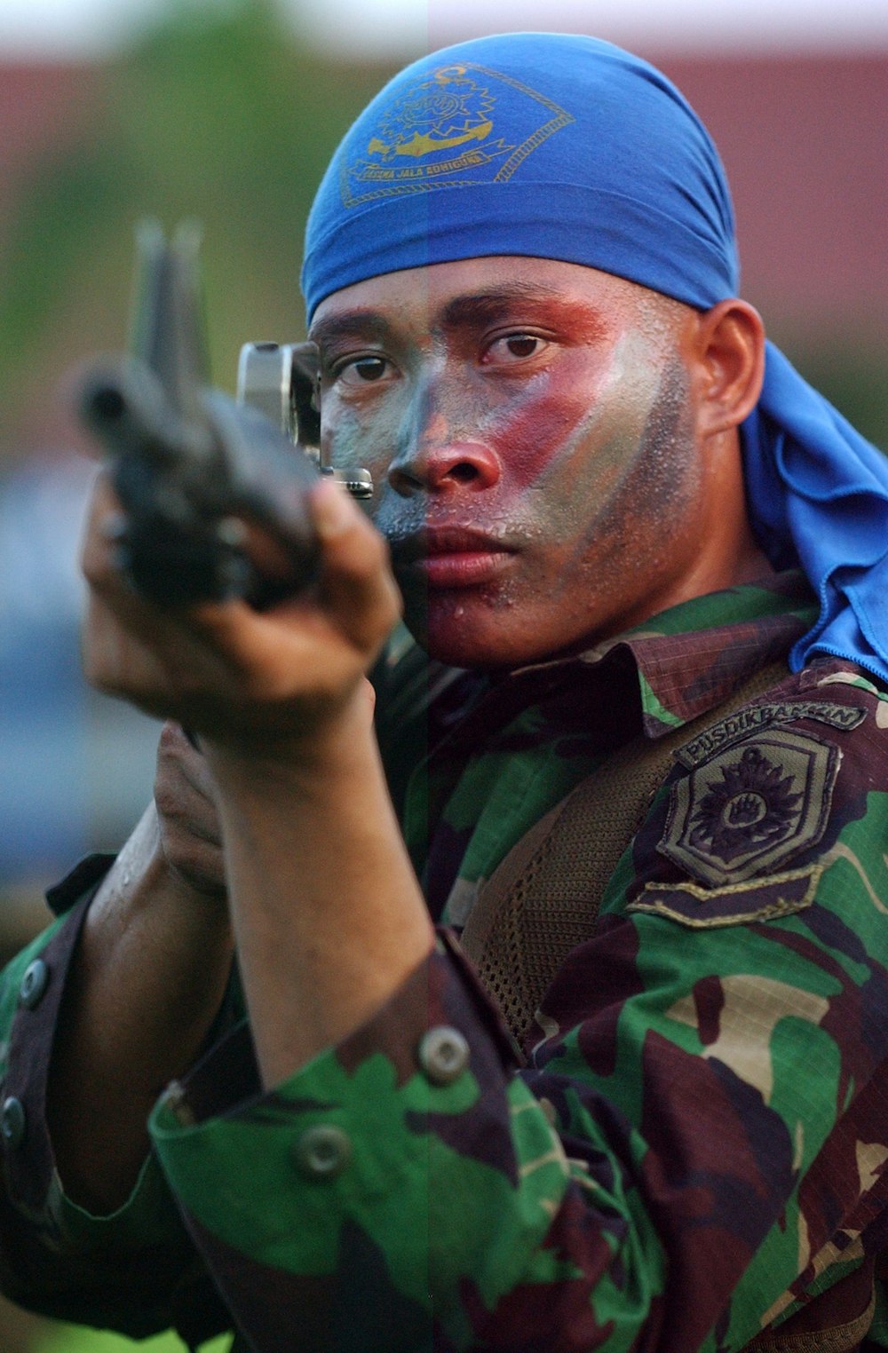 a man in a uniform holding a gun