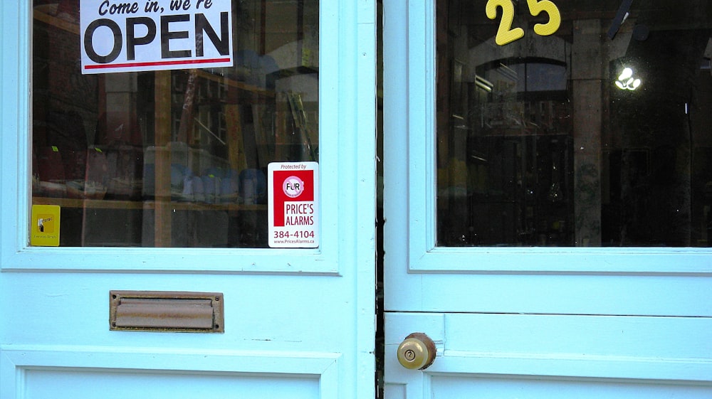 a blue door with a sign on it