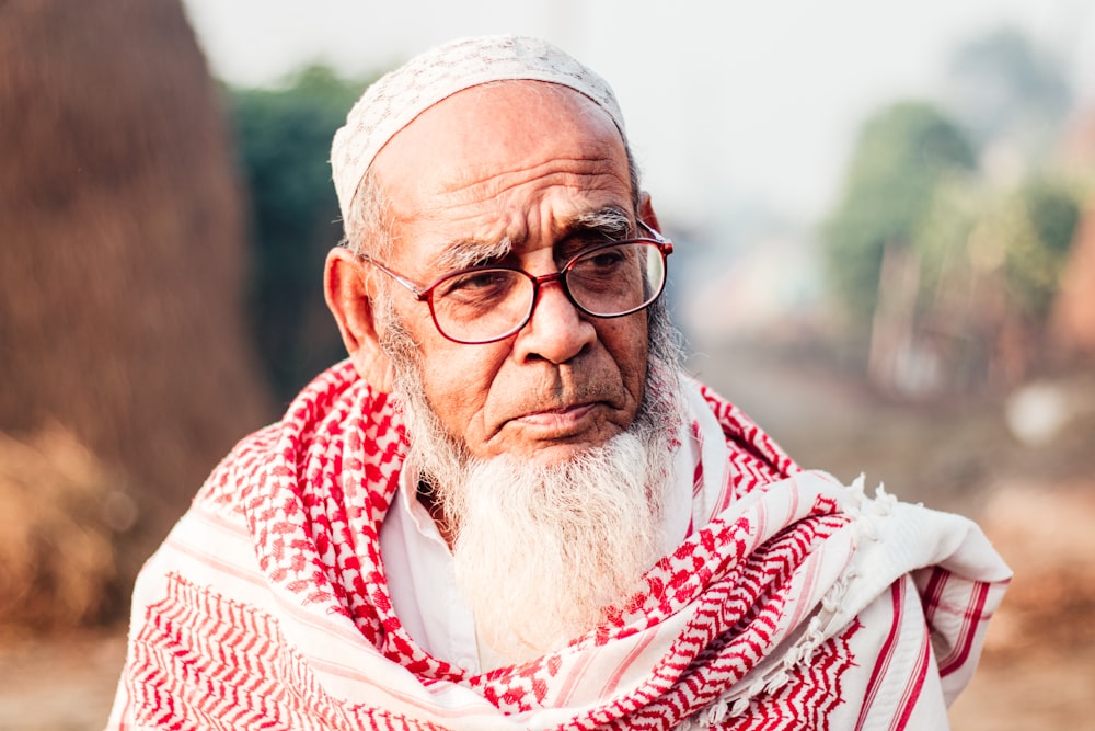 a man with a white beard and glasses