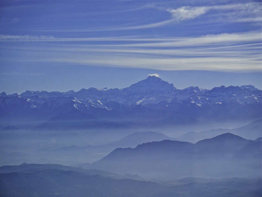 a mountain range with clouds