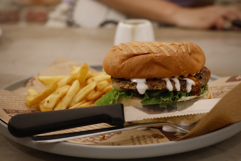 a burger and fries on a plate