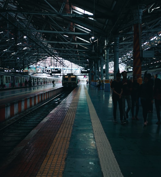 a train station with people waiting