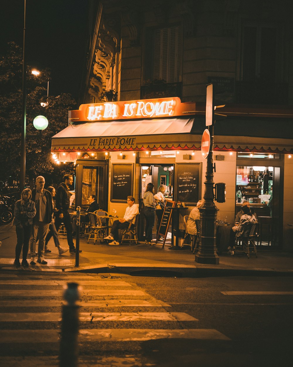 a group of people outside a restaurant