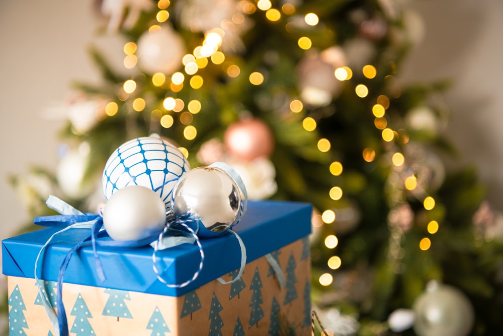 a box with a blue and white ball and a tree in the background