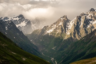 a mountain range with clouds