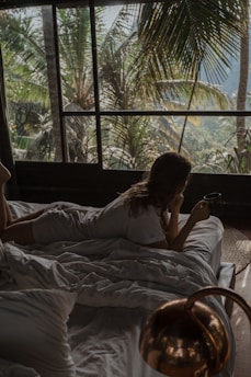 a woman lying on a bed