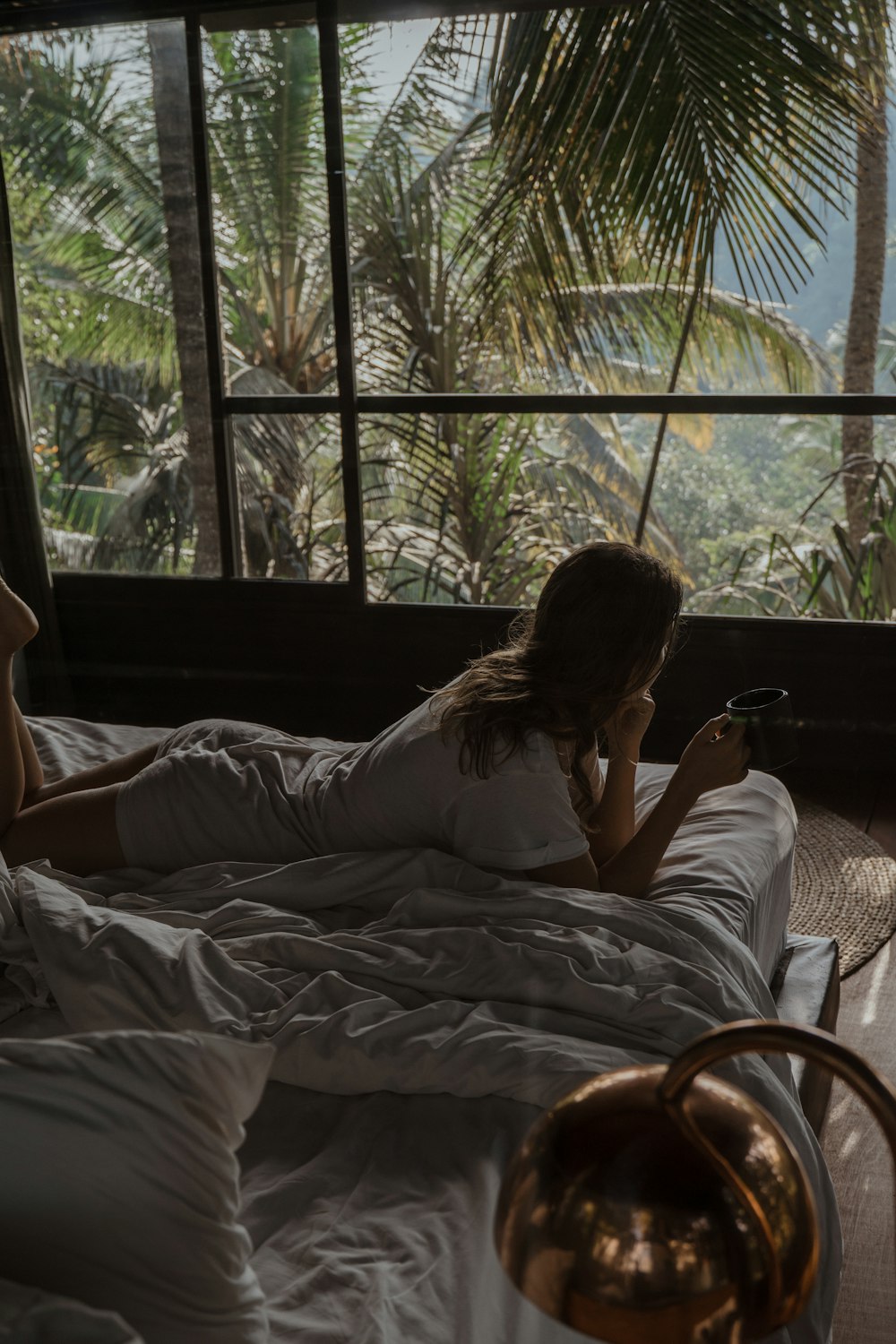 a woman lying on a bed