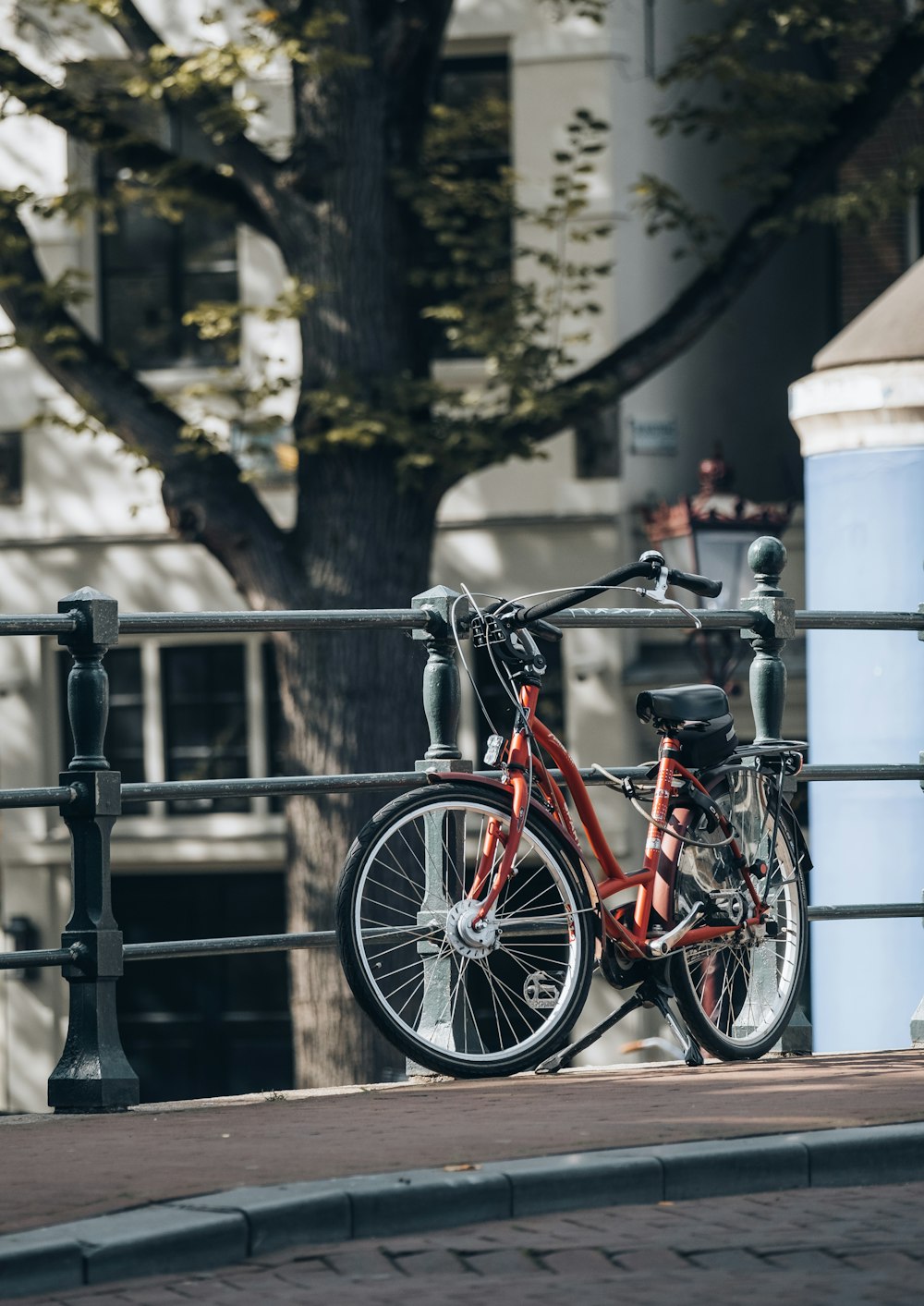 a bicycle parked on a fence