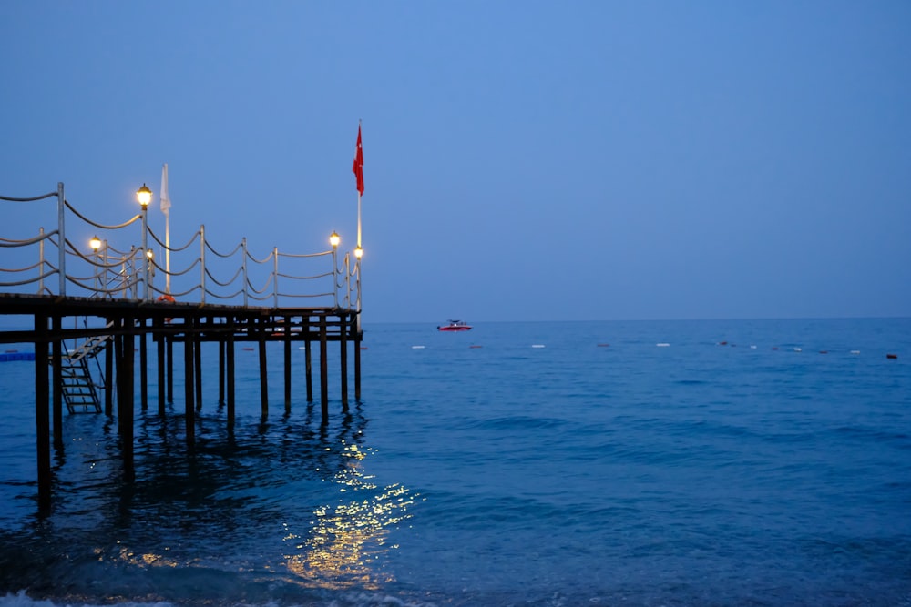 a pier with lights on it