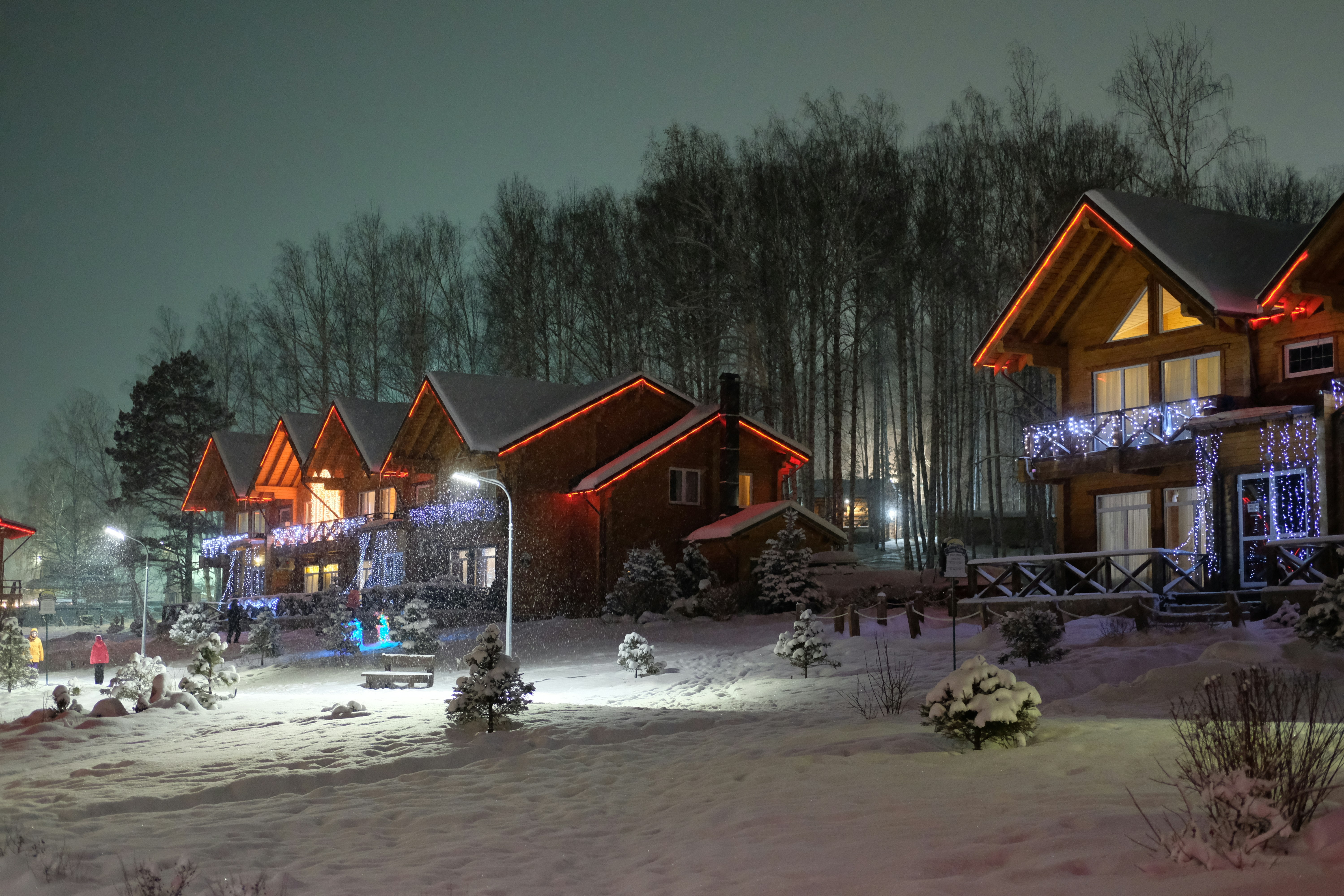 a house with lights on at night