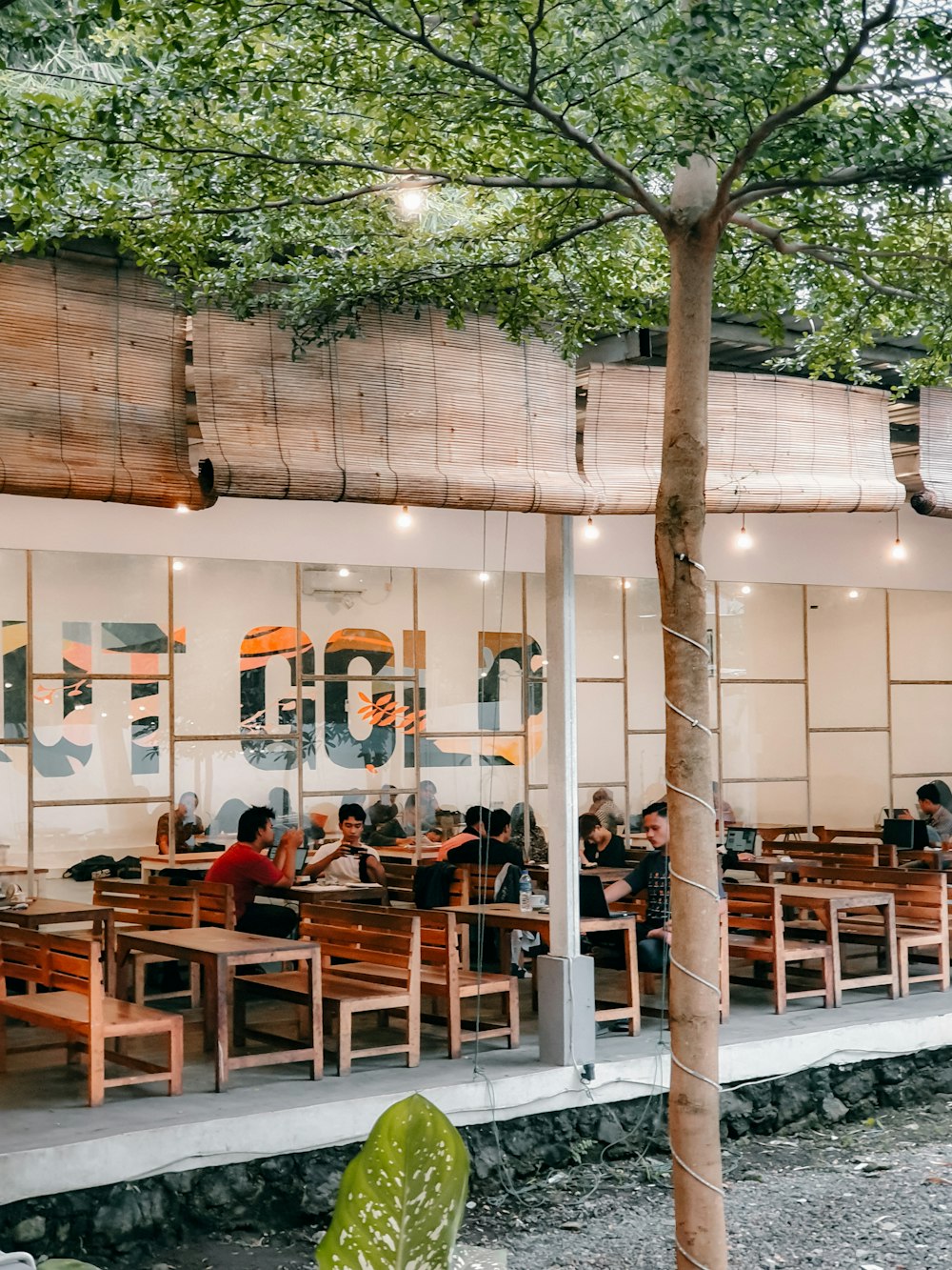 a group of people sitting at tables