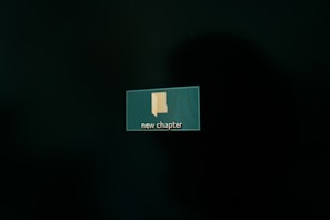 A computer screen displaying a digital folder icon labeled 'new chapter' set against a dark background.