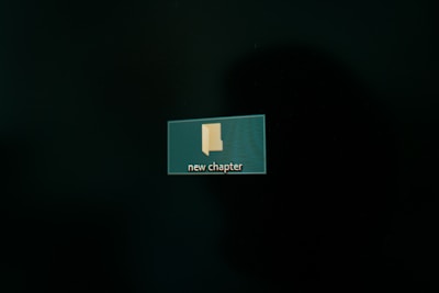 A computer screen displaying a digital folder icon labeled 'new chapter' set against a dark background.