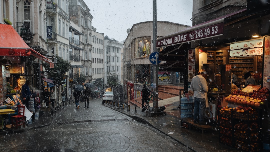 a busy street with people and shops,