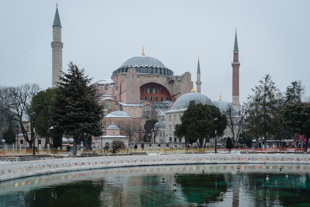 a large building with towers and domes with Hagia Sophia in the background