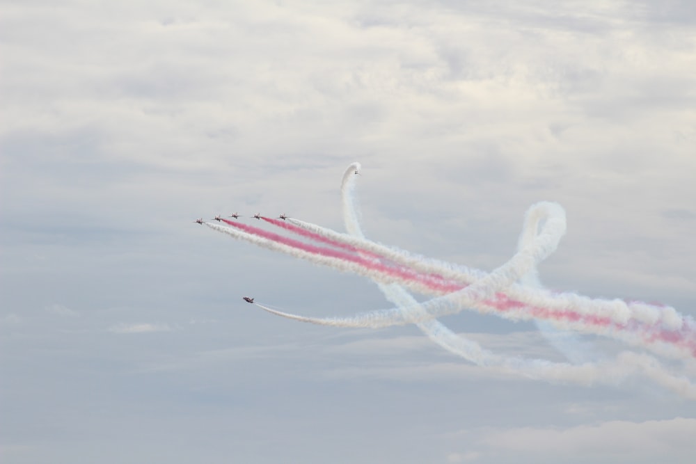 a group of people flying kites