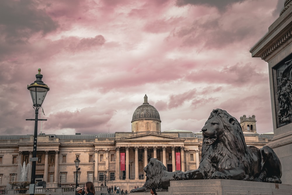 a large building with a statue in front of it