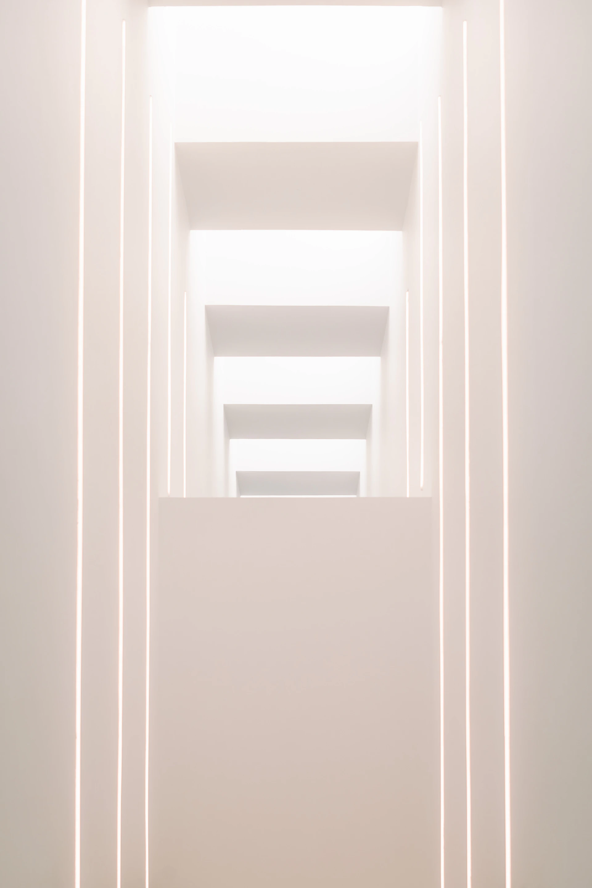 A detailed 3D visualization of a commercial complex showcasing minimalist design and natural textures under subtle ambient light.