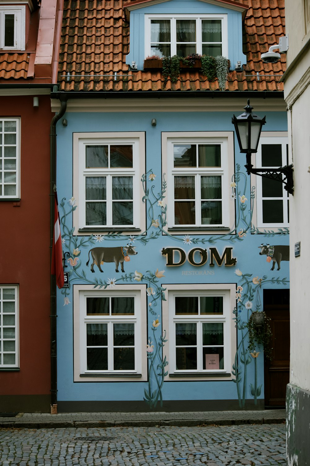 a building with windows and a light post