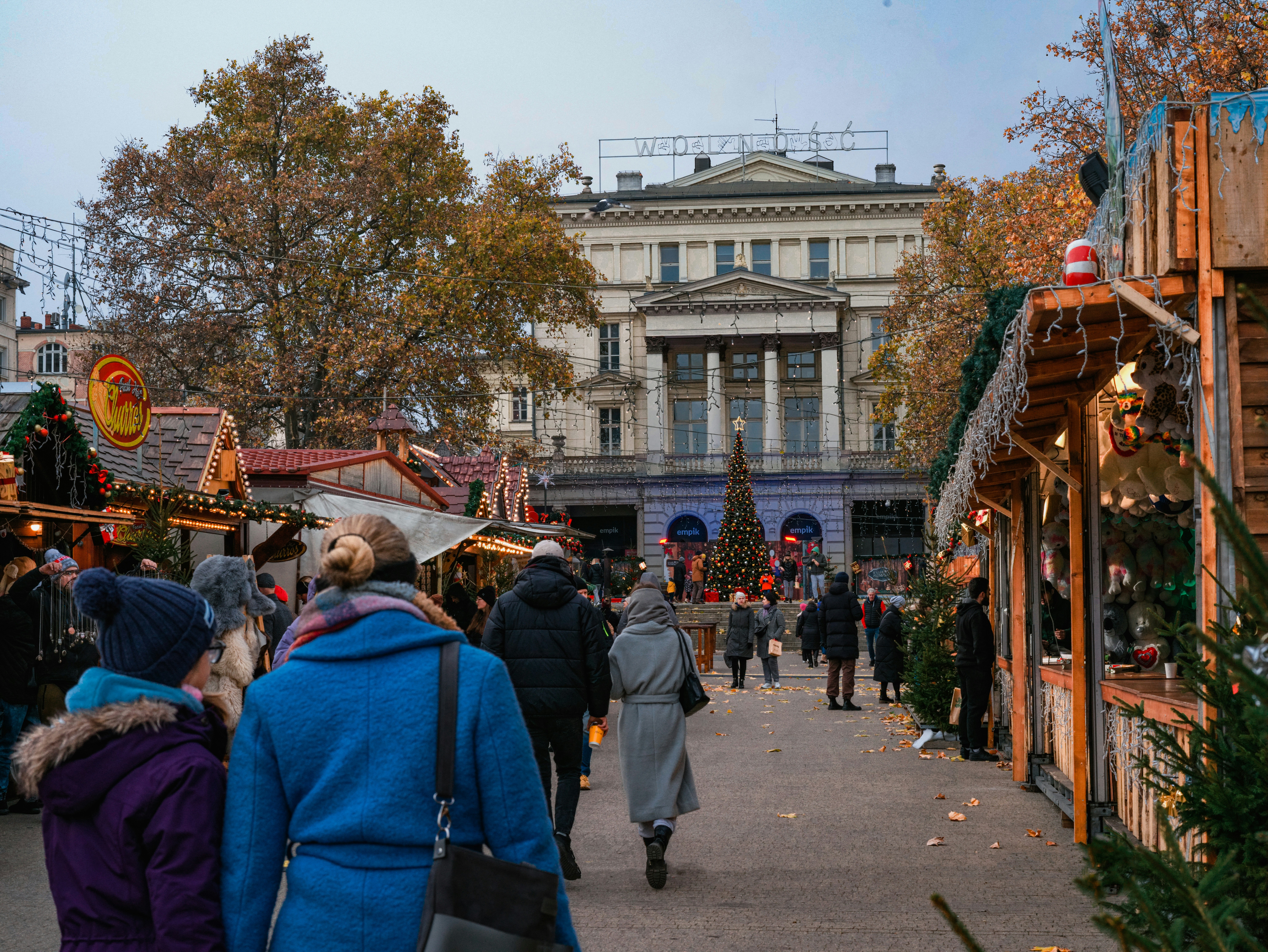 a group of people walking around a fair