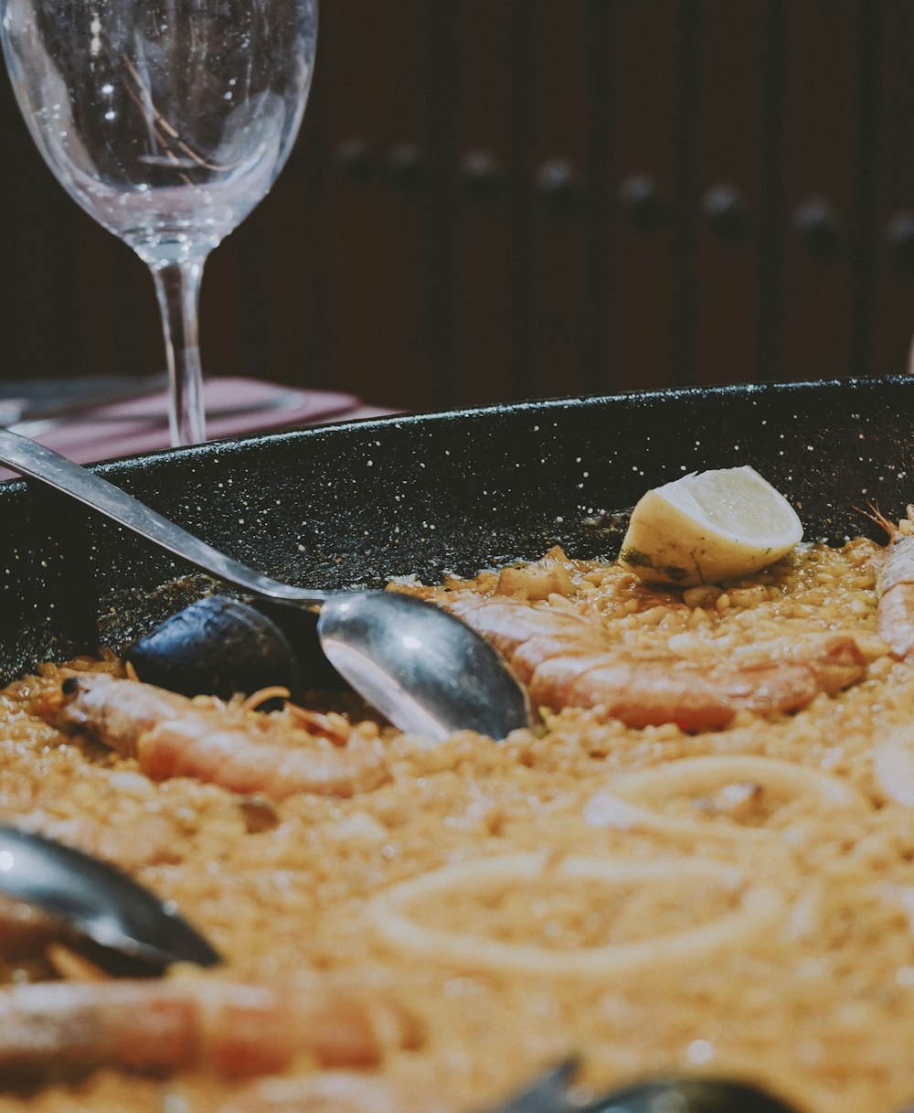 a plate of food and a glass of wine