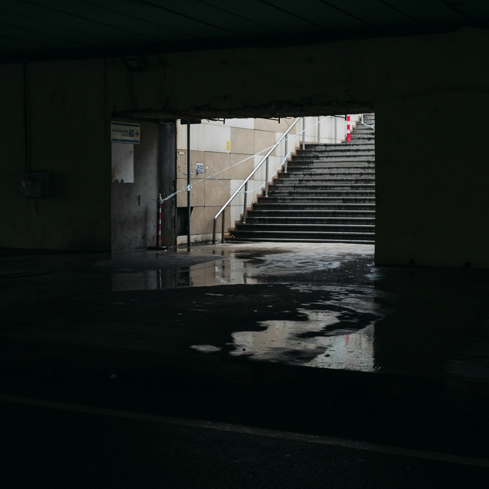 a dark stairwell with a light on the top