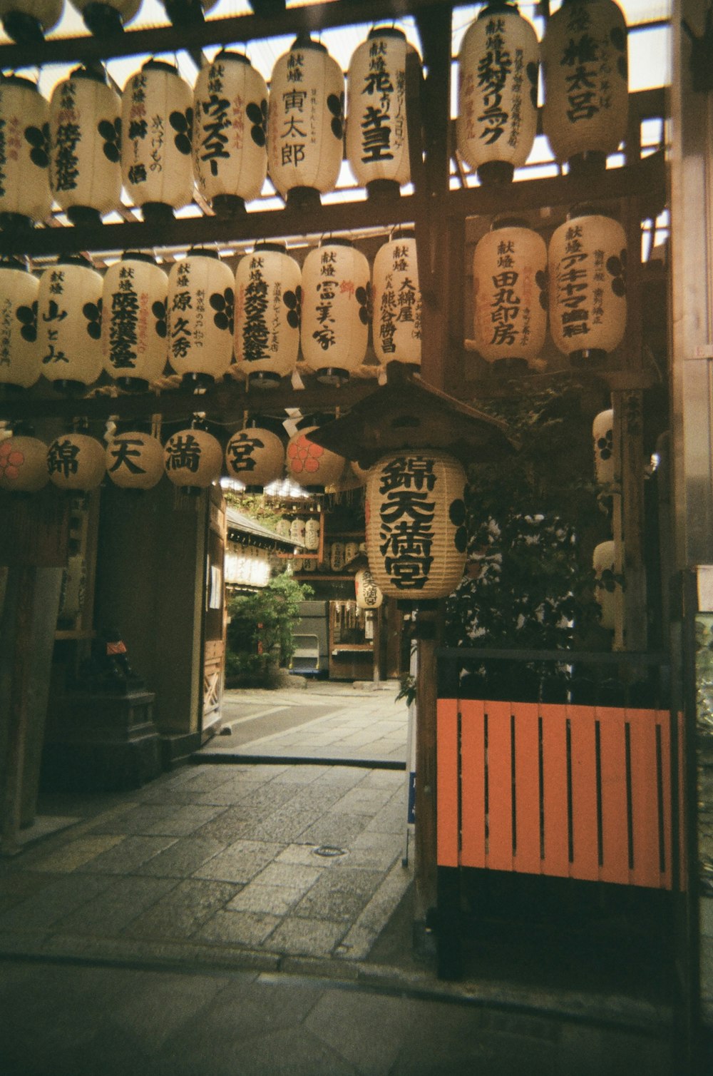 a building with lanterns from the ceiling