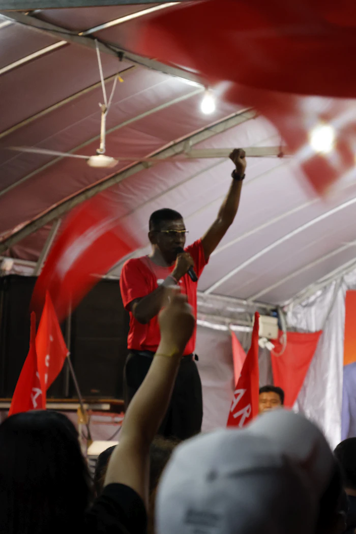Campaign speaker with microphone — digital outreach