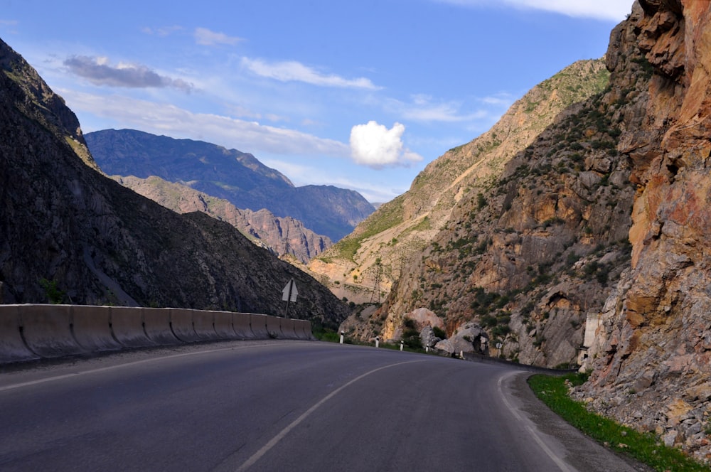 a road in the mountains with Hells Canyon in the background