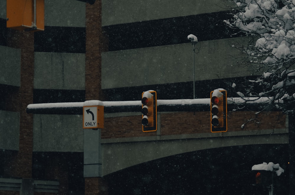 a couple of stop lights on a pole