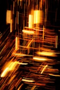 Abstract display of blazing sparks and streaks of light that appear to be in motion, creating an energetic and dynamic composition against a dark background.